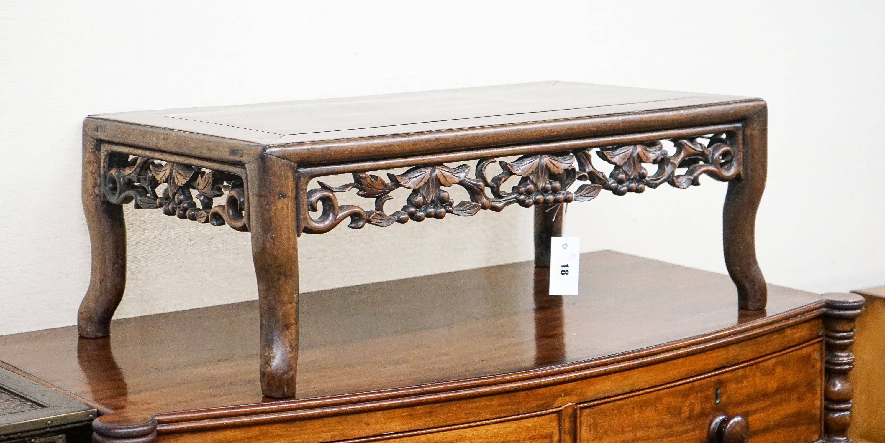 A Chinese carved hongmu low occasional table, width 76cm, depth 41cm, height 27cm